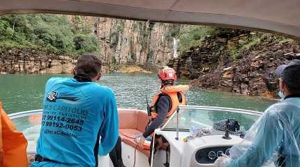 firefighter seeks for victms after a rock collapsed below a waterfall