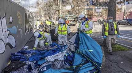 City of Seattle workers remove tents