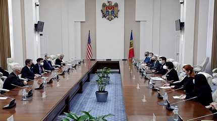 S. Secretary of State Antony Blinken sits at a meeting