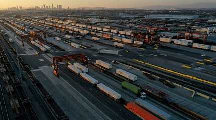 gantry cranes, shipping containers, and freight railway trains ahead of a possible strike