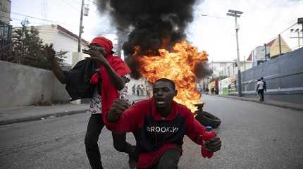 Protesters burning tires during a protest against the government