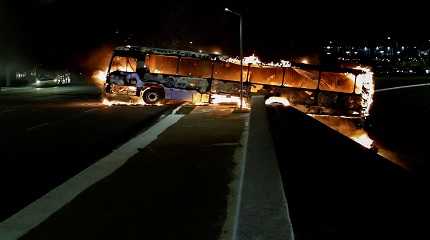 bus is seen on fire as supporters of Brazil's President Jair Bolsonaro protest