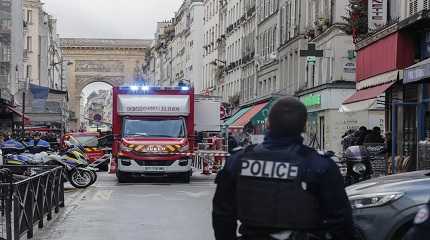 police officer stands next to the cordoned off area