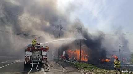 Firefighters work to extinguish a fire