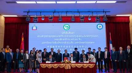 Guests attend the signing ceremony of an agreement