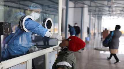 healthcare worker collects a test