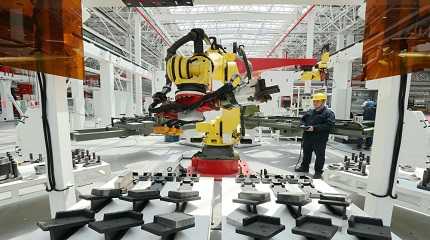 technician checks a production line