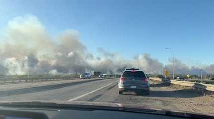 Smoke rises from a wildfire