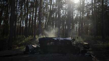 Smoke rises from burning humvee vehicle