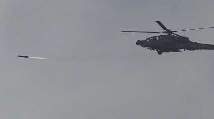 helicopter fires a missile