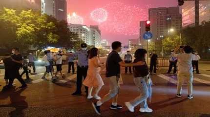 People watch a rehearsal of a fireworks