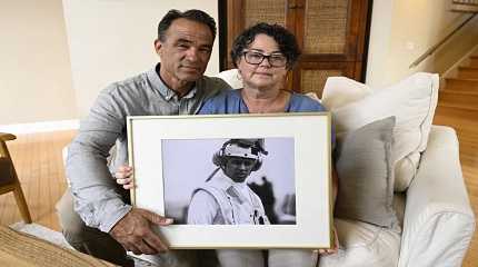 Derek and Suzi Alkonis with a photo of son Lt Ridge Alkonis