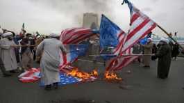 Clerics burn U.S. flag during the annual rally anniversary of Iran's