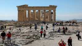 People visit the ancient Parthenon Temple