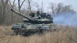 Ukrainian armed forces are seen atop of a tank