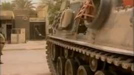  US Troops opening door of bank in Iraq with tank