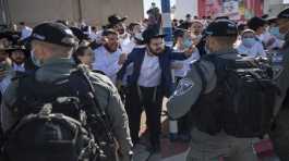 Ultra-Orthodox Jews argue with Israeli border police officers