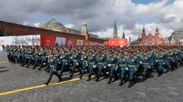 Russian service members march during a parade on Victory Day
