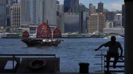 Chinese junk sails across Victoria Harbor to celebrate the 25th anniversary