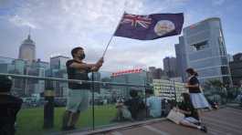 protester waves Hong Kong British colony flag