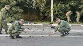 Russian investigators work on the site of explosion