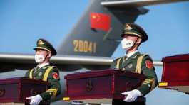 Chinese soldiers receive coffins