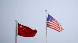 Chinese and U.S. flags flutter