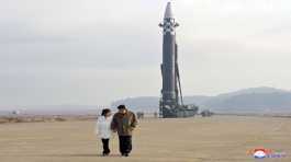 Kim Jong Un, along with his daughter