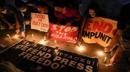 Philippines Activists light candle
