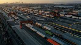 gantry cranes, shipping containers, and freight railway trains ahead of a possible strike