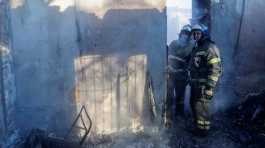 Firefighters work inside a building