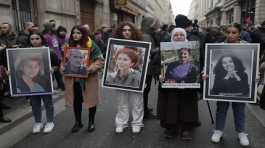 Kurdish activists holds portraits