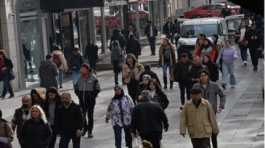 People walk on a street in Ankara