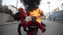 Protesters burning tires during a protest against the government