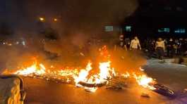 police motorcycle burns during a protest