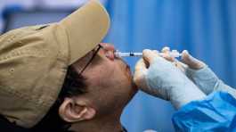 resident receives a nasal spray vaccine