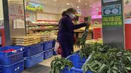 woman shops in a reopened grocery store