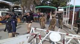 Army soldiers and police at bomb explosion site