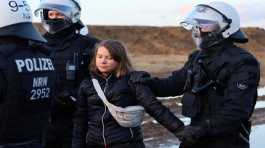 Police officers detain Greta Thunberg 