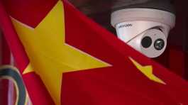 Chinese flag hangs near a security camera