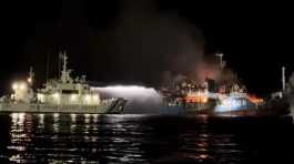 Philippine Coast Guard ship tries to extinguish fire