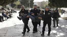 Israeli police detain a Palestinian