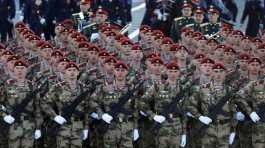 Russian service members march  for a military parade