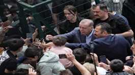 Tayyip Erdogan with supporters at a polling station