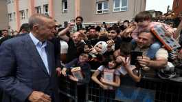 Turkish President Tayyip Erdogan greets his supporters