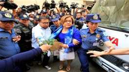 Philippine police escort Leila de Lima