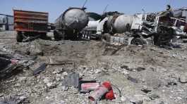 destroyed trucks after Russian shelling