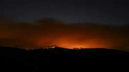 Fire burns in a forest in Dervenohoria