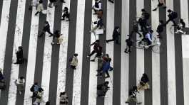 People walk Ginza shopping street