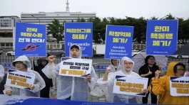 protesters stage a rally against a meeting of nuclear consultative
